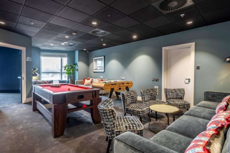 Residents’ games room at Circus Apartments with pool table, table football and lounge seating