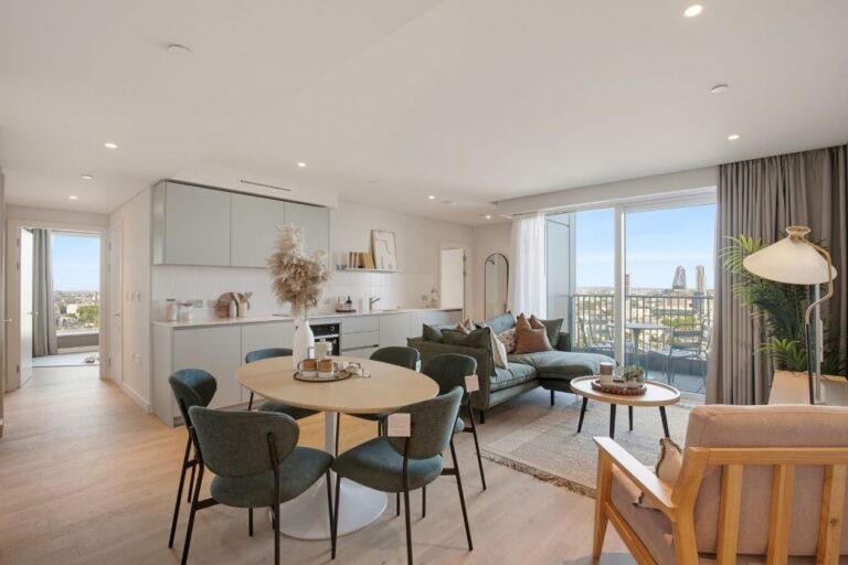Open-plan living and dining area with private balcony and London views at Lumina House