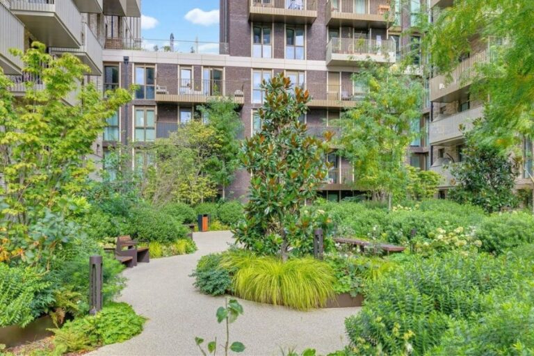 Landscaped communal gardens surrounded by apartments at London Dock in Wapping